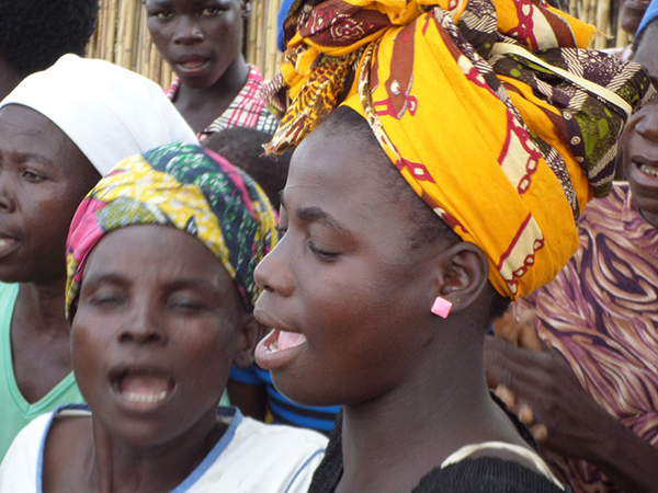Mozambican women sing during a worship service.