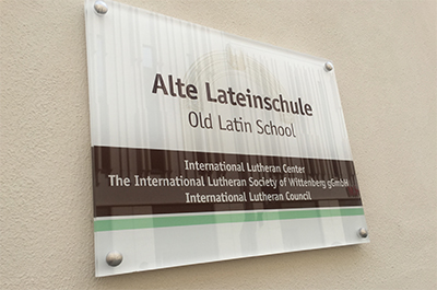 The sign at the Old Latin School, noting the center's relationship with the International Lutheran Council.